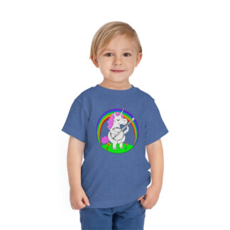 A toddler wearing a banjo shirt with a graphic of a unicorn playing the banjo framed by a colorful rainbow